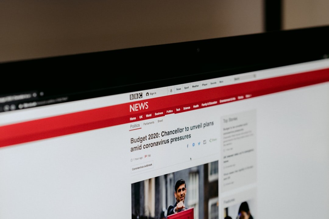 Laptop showing advertising analytics dashboard for a news website
